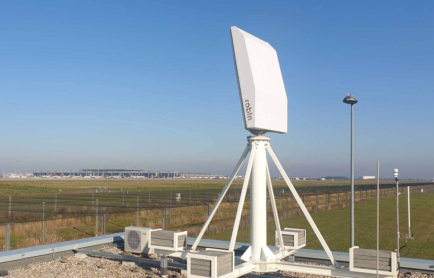 MAX bird detection radar mounted on a building and deployed at an airport