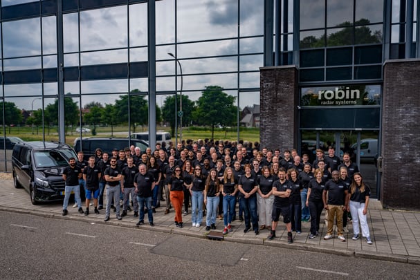 Robin Radar System team outside the office building 