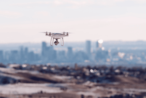 Unmanned aerial system approaching a distant city