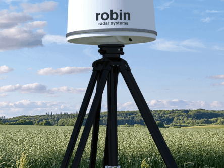 Close-up of IRIS drone detection radar deployed in a green field