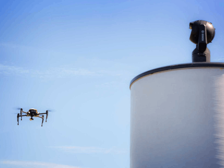 ELVIRA drone detection radar watches a drone hovering beneath a clear blue sky