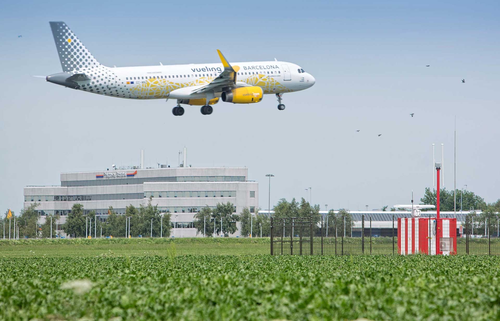 Commercial aeroplane approaching a runway at Schiphol airport